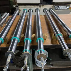 Finished Ram Production Batch — Astro Tool & Machine Co. Row of finished, precision-machined rams staged for shipment at Astro Tool & Machine Co.
