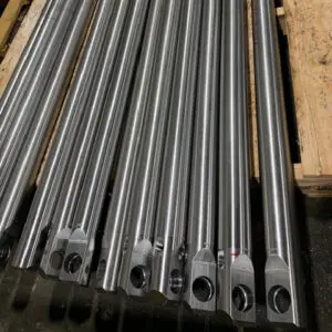 Finished Bodymaker Rams — Astro Tool & Machine Co. Row of finished bodymaker rams staged for shipment at Astro Tool & Machine Co.