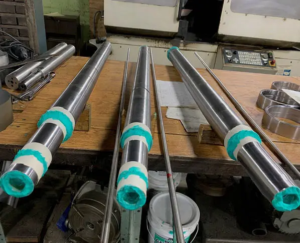 Rams Staged for Shipment — Astro Tool & Machine Co. Batch of finished rams staged on a pallet, ready for worldwide shipment from Astro Tool & Machine Co.