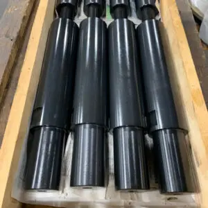 Finished Shafting Batch — Astro Tool & Machine Co. Batch of finished, black-oxide coated shafts crated for shipment at Astro Tool & Machine Co.